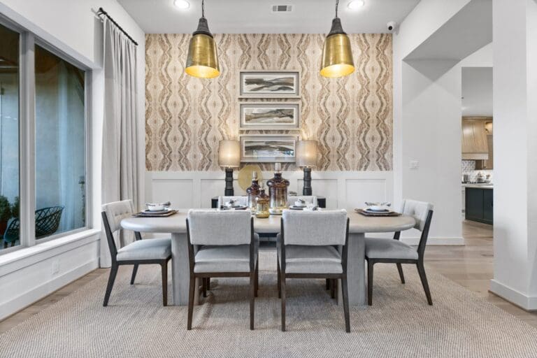 Dining room in new construction home San Antonio with statement lighting and accent wall