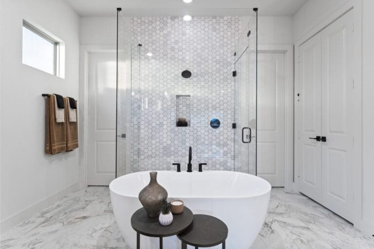 Luxury bathroom in new build San Antonio home with walk-in shower and marble design